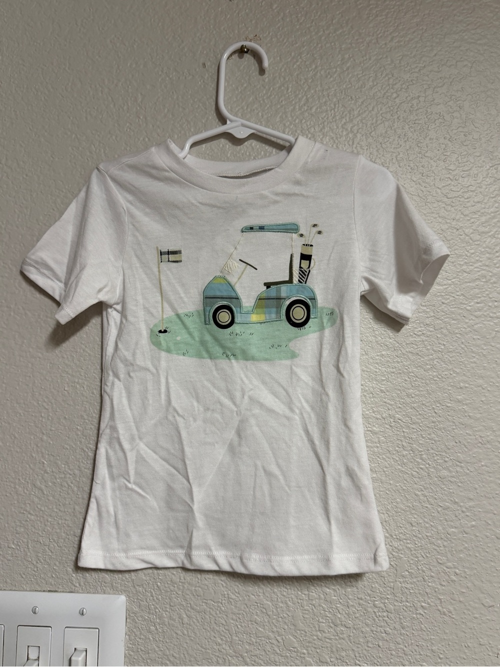 First Impressions White Tee with Green & Teal Golf Cart Art